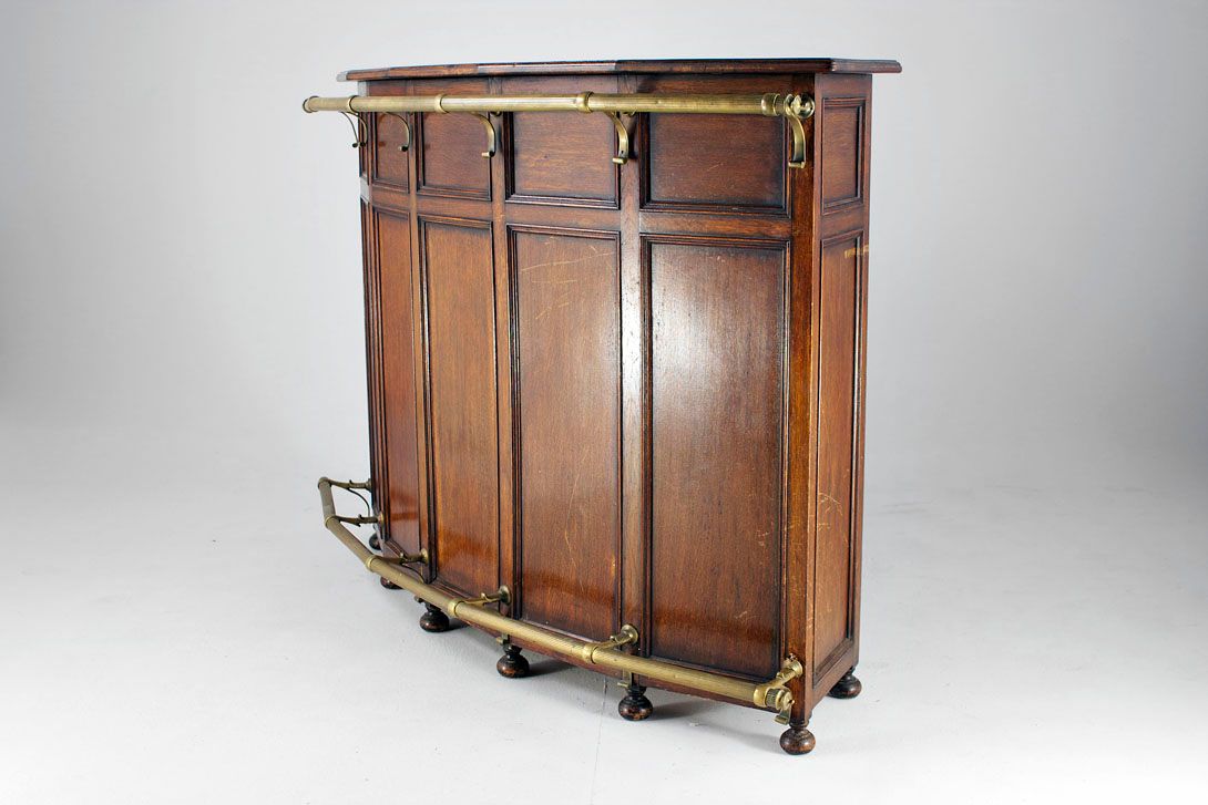 Foto Curved Oak Bar with Brass Cowcatchers 1895 h122x177x53
