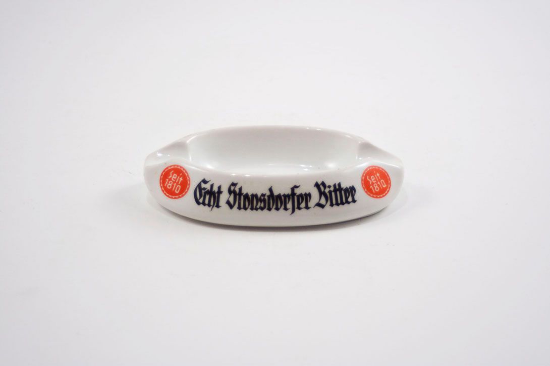 Foto Almond-Shaped Ashtray, White Porcelain, Echt Stonsdorfer Bitter Label