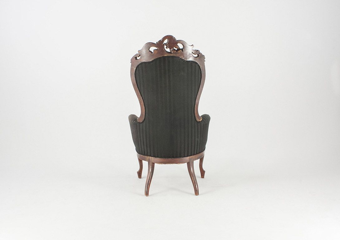 Foto Antique Armchair with Carved Back Detail and Black Upholstery