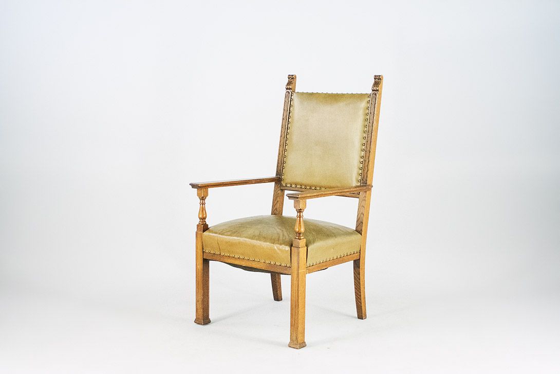 Foto Armchair with Leather Upholstery and Carved Back Details