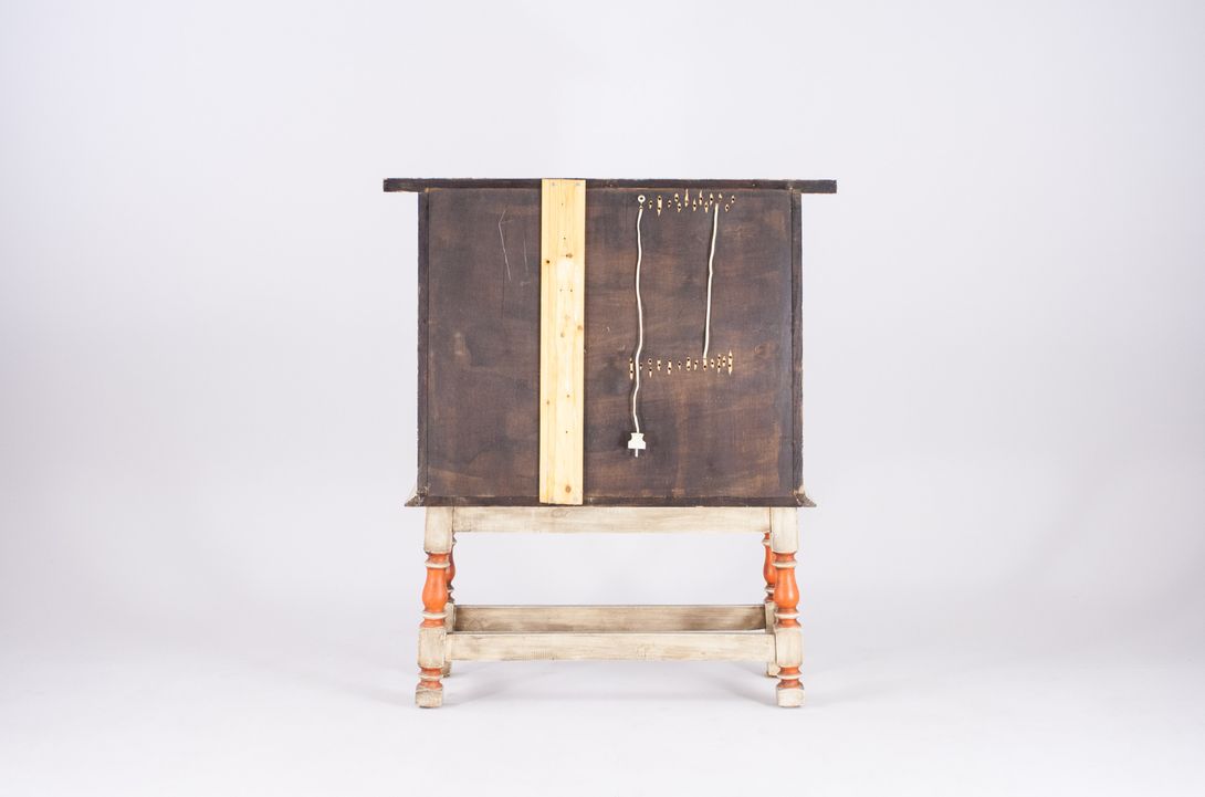 Foto Small Wooden Cabinet with Carved Zodiac Signs Relief