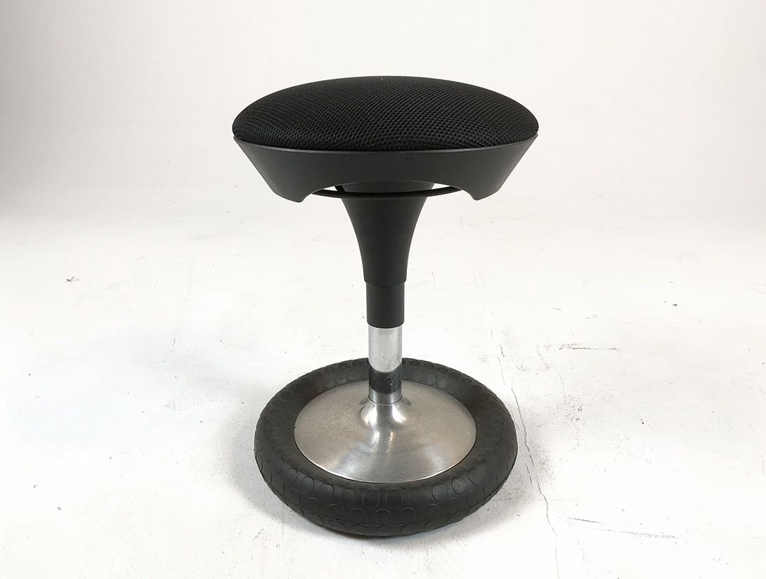 Foto Black Stool Standing on Car Tire