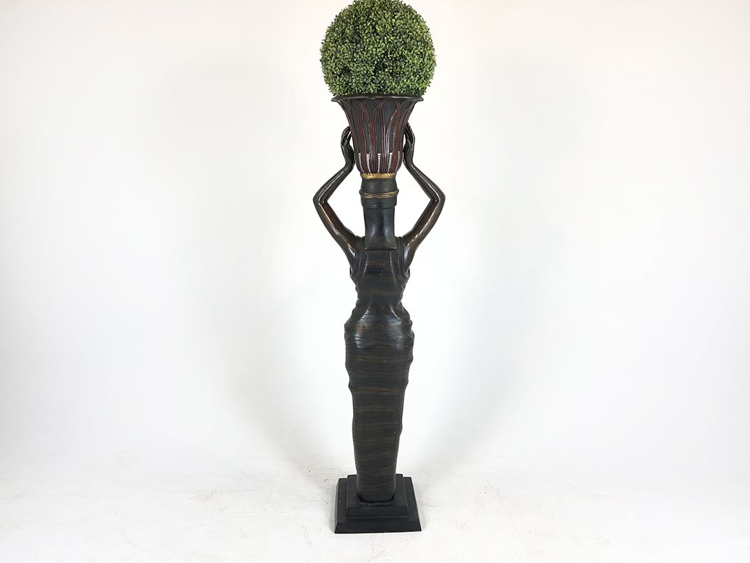 Foto Woman Holding Flowerpot with Fake Plant