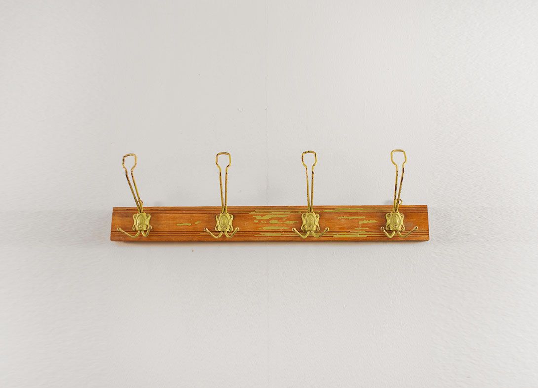 Foto Decorative Iron Hangers on Wooden Board