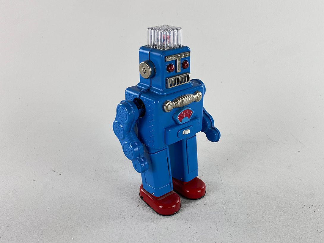 Foto Blue Robot with Shining Red Eyes