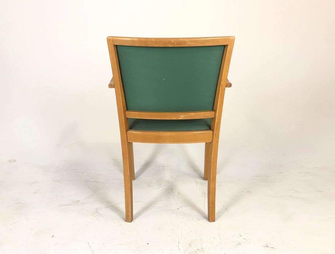Foto Armchair with Green Upholstery and Wooden Frame