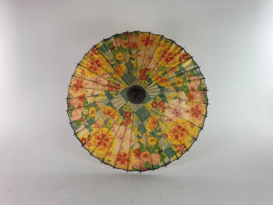 Foto Colorful Flowered and Checkered Umbrella