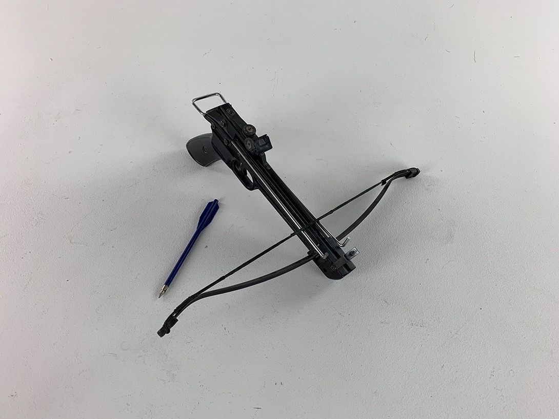 Foto Black Crossbow with Blue Arrow