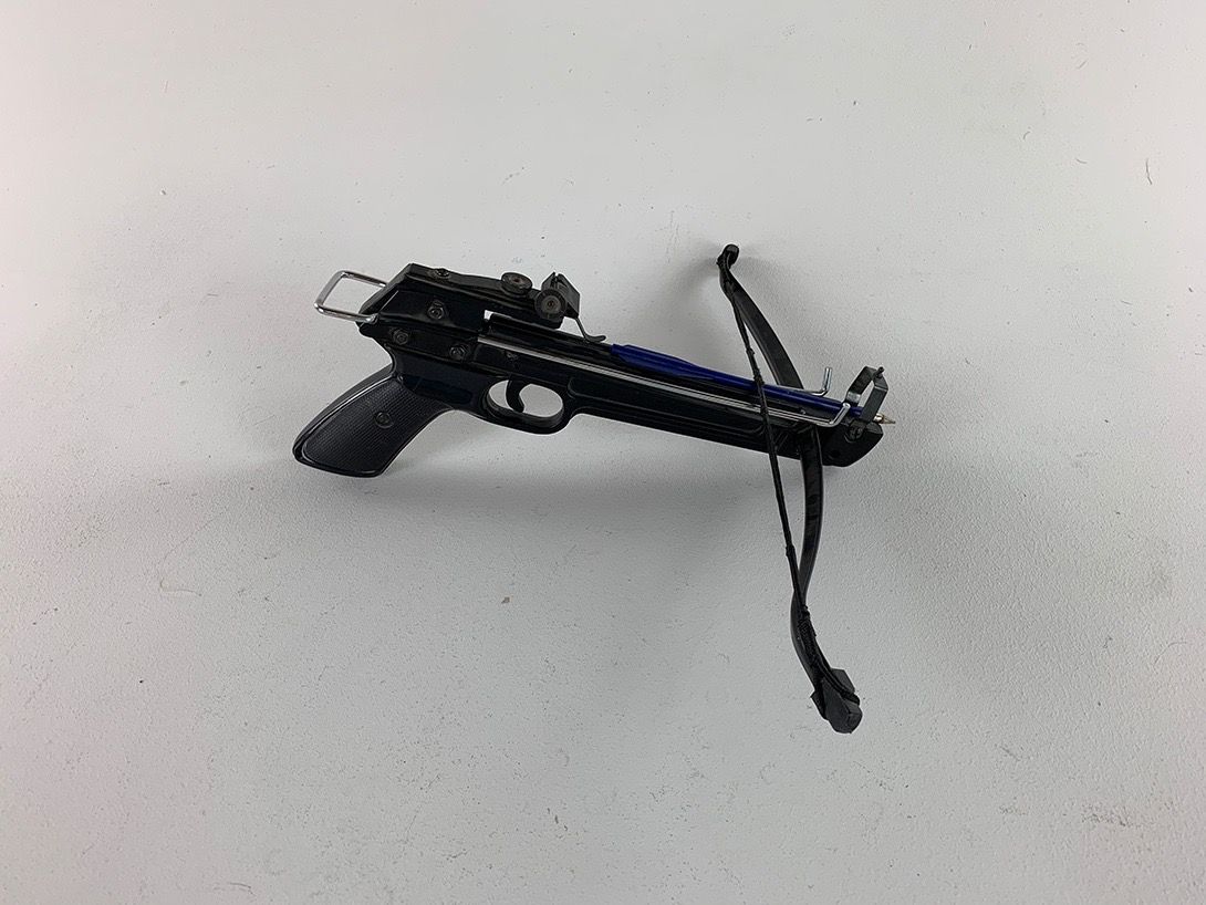 Foto Black Crossbow with Blue Arrow