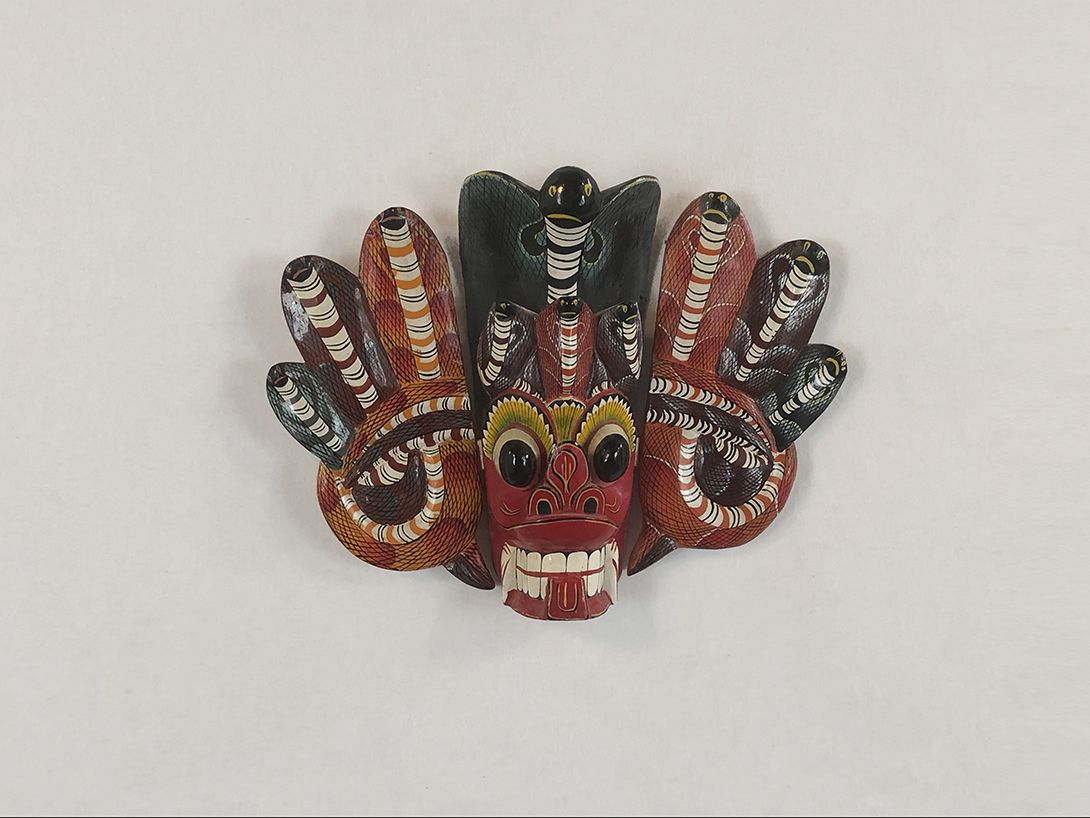 Foto Indonesian Dragon Mask with Six Cobras