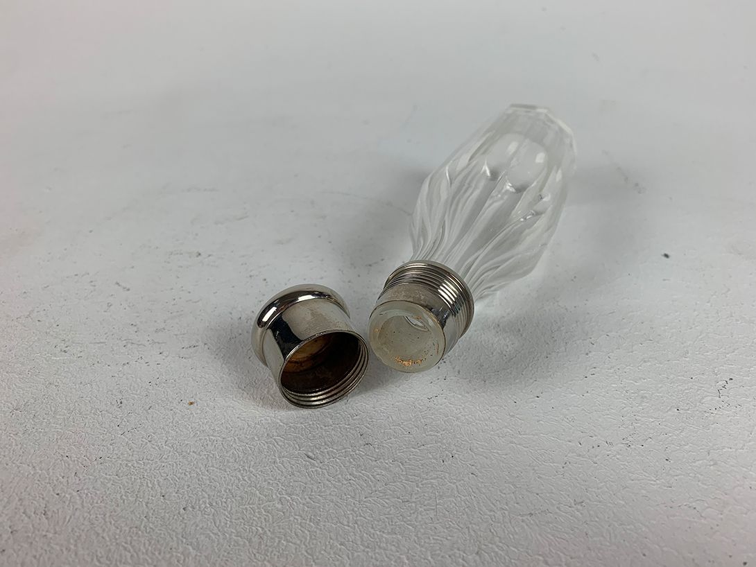 Foto Antique Glass Bottle with Silver Lid