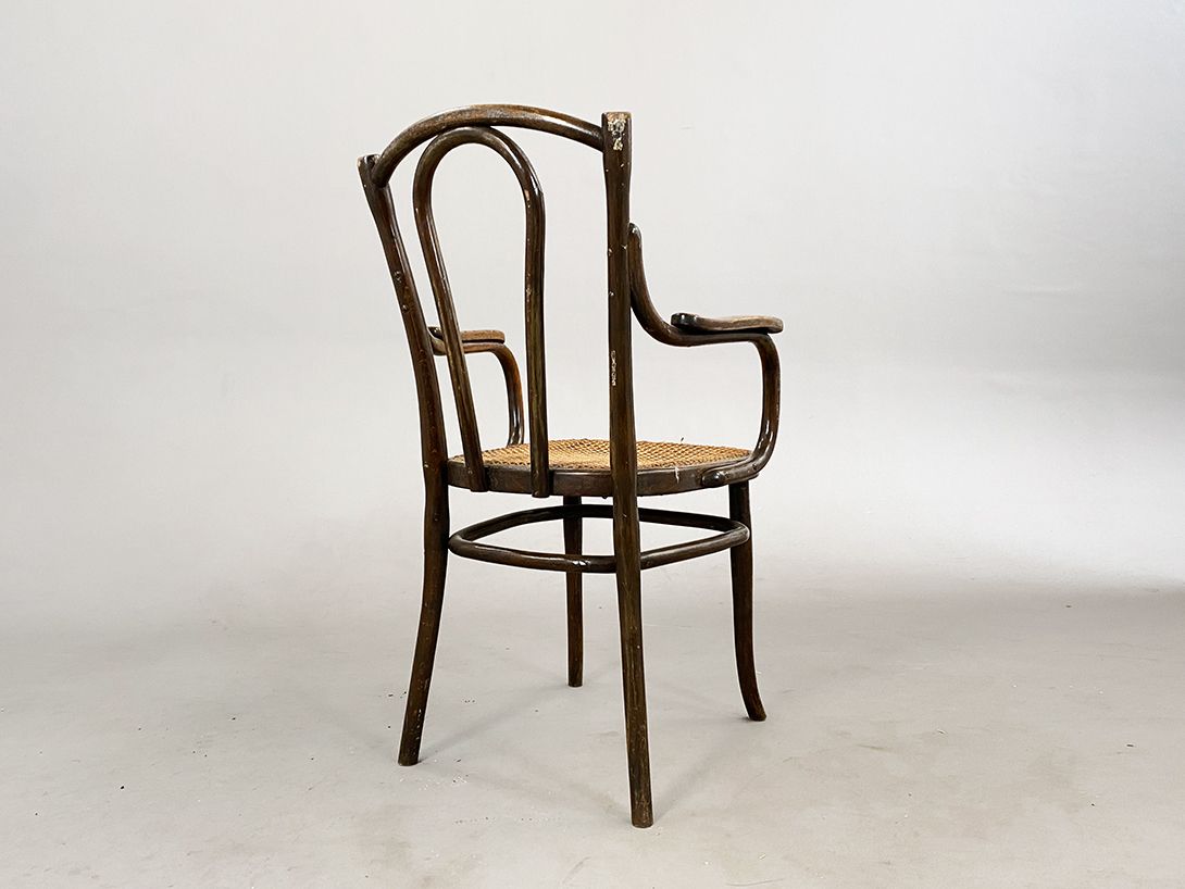 Foto Antique Brown Wickered Armchair