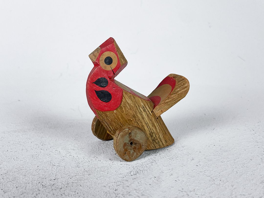 Foto Japanese Wooden Toy Bird on Rolls h9