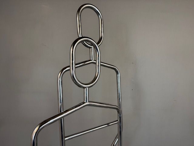 Foto Chrome Standing Coat Racks in the Shape of Persons