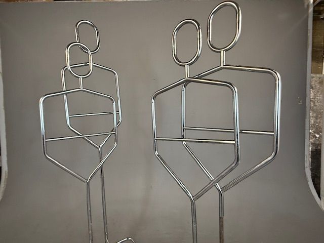 Foto Chrome Standing Coat Racks in the Shape of Persons